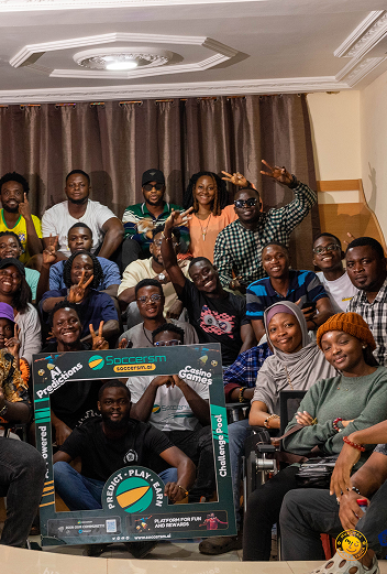 Two people standing by a banner