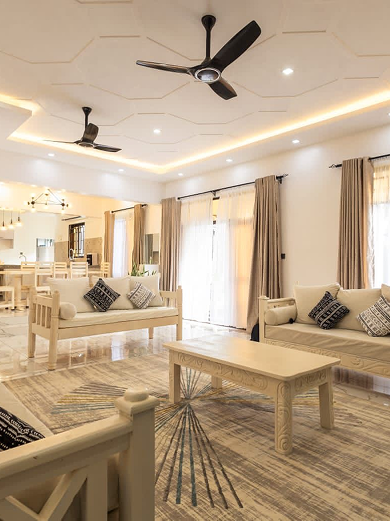 Two people standing by a banner